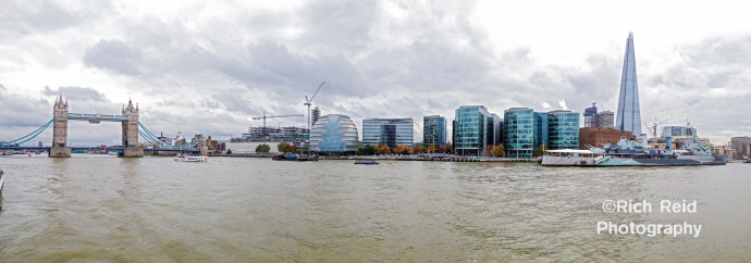 Panorama from a boat on the Thames River of the Tower Bridge and Shard in London, UK.